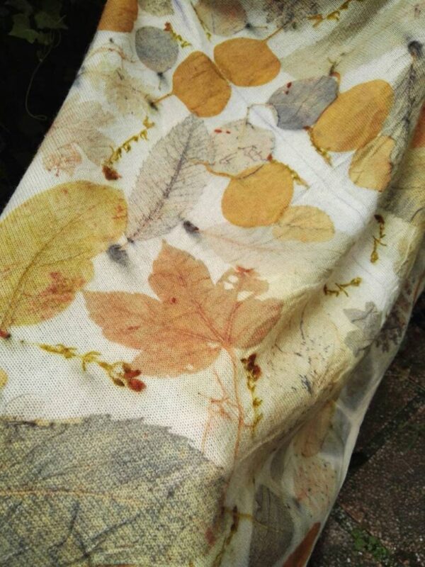 Hand dyed cashmere poncho with imprinted leaves and plants.