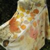 Hand dyed cashmere poncho with imprinted leaves and plants.