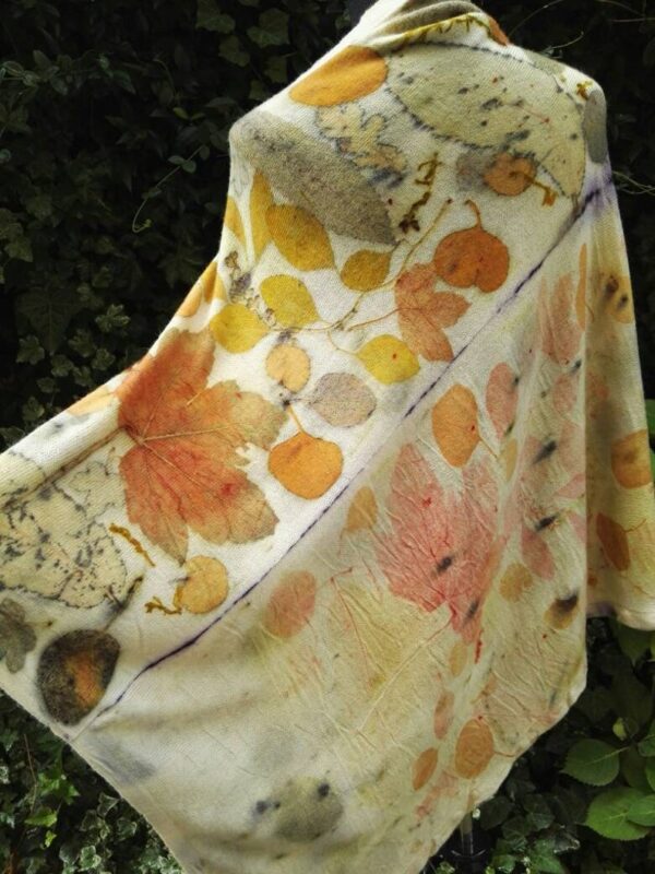 Hand dyed cashmere poncho with imprinted leaves and plants.