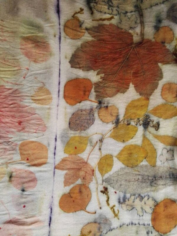 Hand dyed cashmere poncho with imprinted leaves and plants.