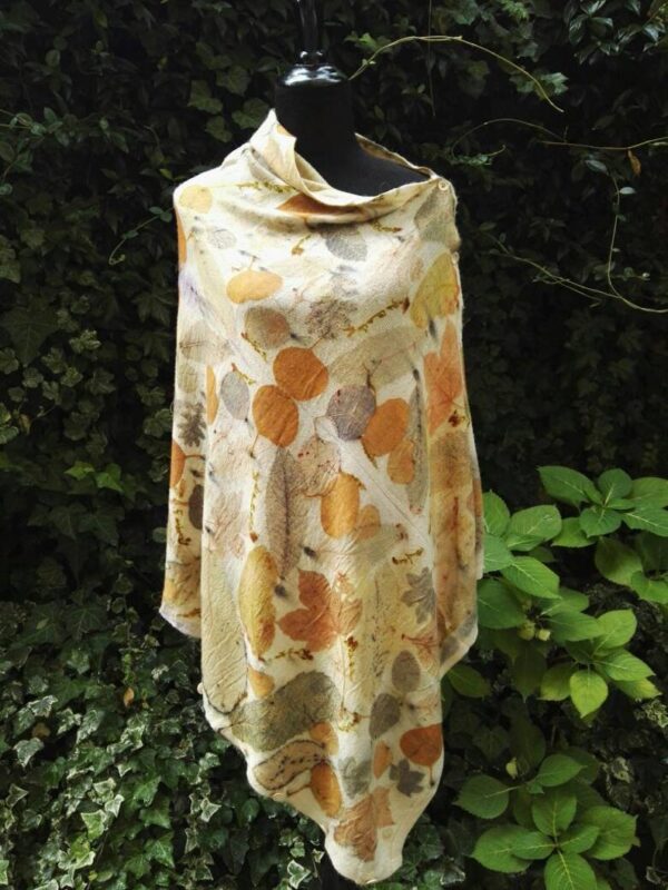 Hand dyed cashmere poncho with imprinted leaves and plants.