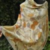 Hand dyed cashmere poncho with imprinted leaves and plants.