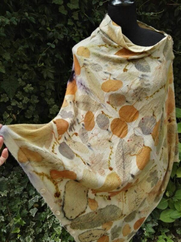 Hand dyed cashmere poncho with imprinted leaves and plants.