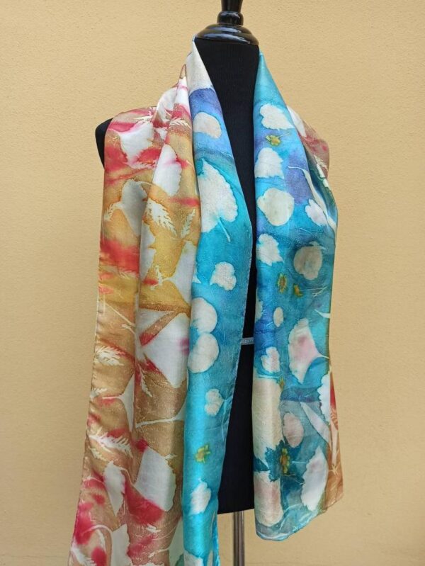 Blue and yellow hand dyed 100% silk scarf with imprinted leaves and flowers. Original colorful accessory to complete any outfit.