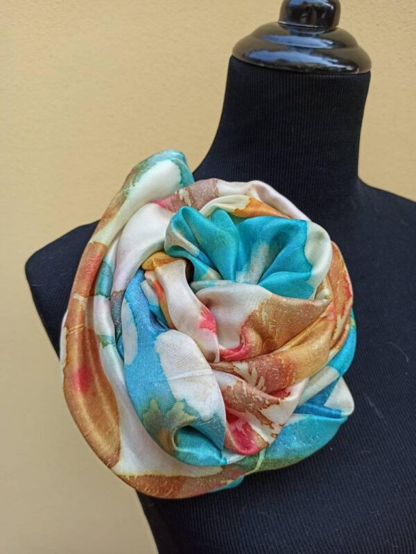 Blue and yellow hand dyed 100% silk scarf with imprinted leaves and flowers. Original colorful accessory to complete any outfit.