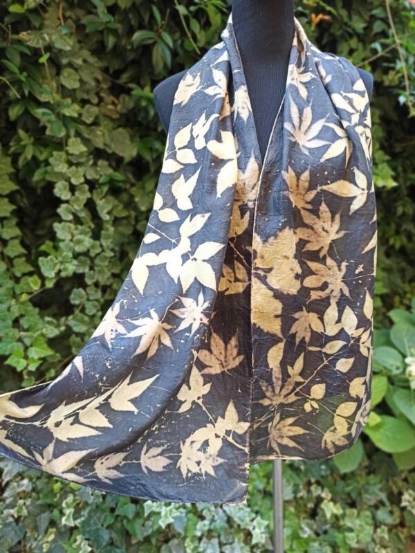 Elegant black ecoprint 100% silk scarf. Leaves and plants impressed on fabric. Ecoprinting and natural dyeing.